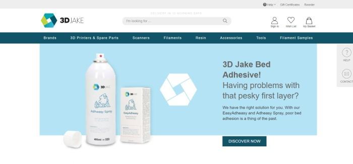 This screenshot of the home page for 3D Jake has a white and blue background behind adhesive spray next to an advertisement for 3D Jake adhesive to help with the first layer of a 3D printed product.