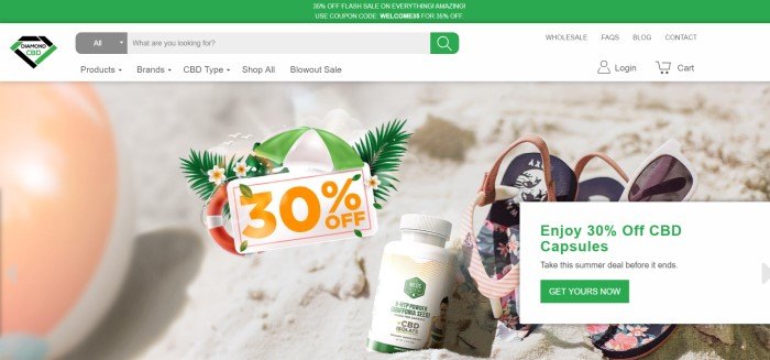 This screenshot of the home page for Diamond CBD shows a beach scene with sandals, a beach ball, and a bottle of CBD oil products lying in the sand near a 30% off advertisement.