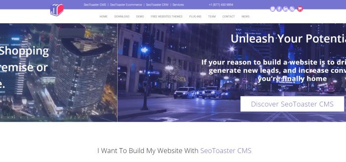 This screenshot of the home page for SEOToaster has two photos of city scenes with white text inviting people to discover SEOToaster.