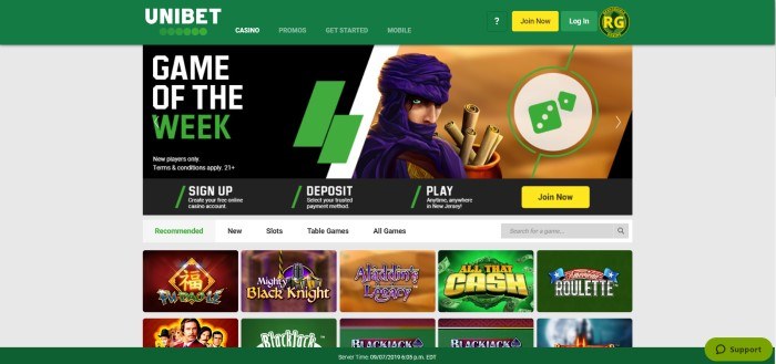 This screenshot of the home page for Unibet has a gray background with a forest green header and footer, along with an image of Aladdin's Legacy as the game of the week and several images of other recommended games below it.