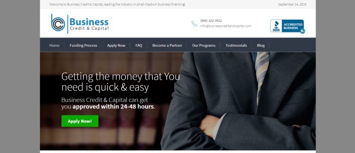 This screenshot of the home page for Credit And Capital shows a man in a dark suit with his arms folded, near white text that reads "Getting the money that you need is quick and easy" above a green call-to-action button for applying now.