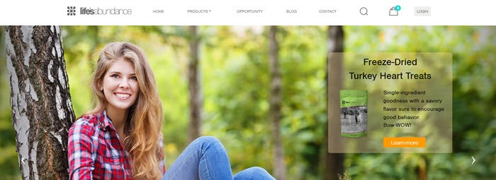 Lifes Abundance Website Screenshot showing a young woman in a forest and a product image for turkey heart treats