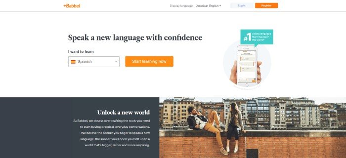 This screenshot of the home page for Babbel has a white background with a photo of a man and a woman sitting on a brick wall in front of a cityscape, as well as a photo showing a hand holding a mobile device with the Babbel app loaded on it and black text that reads "Speak a new language with confidence."