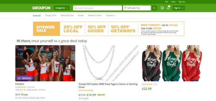 This screenshot of the home page for Groupon has a green header and search bar above a white background with several photos of deals on Groupon, including a restaurant, chain necklaces, Christmas sweatshirts and an orange and white sitewide sale advertisement.