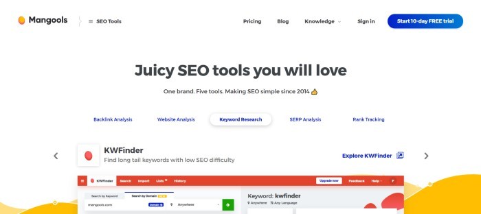 This screenshot of the home page for Mangools has a white background with black text announcing SEO tools and the top of a computer screen with a red header showing the beginning of a keyword search.