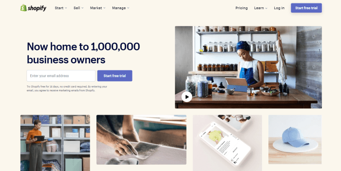 This screenshot of the home page for Shopify has a beige background with a photo of a woman in a blue headdress behind a counter with a laptop, near several glass jars of what appears to be herbs, as well as black text that announces Shopify.