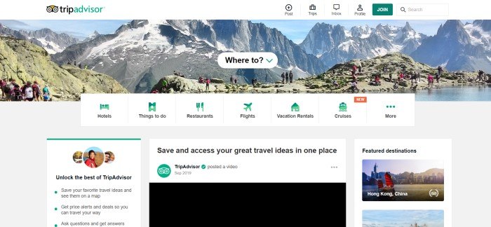 This screenshot of the home page for TripAdvisor shows groups of what appear to be tourists on a rugged mountain ridge, behind a white text box reading "Where to?" and a list of green icons for hotels, things to do, restaurants, flights, and more.