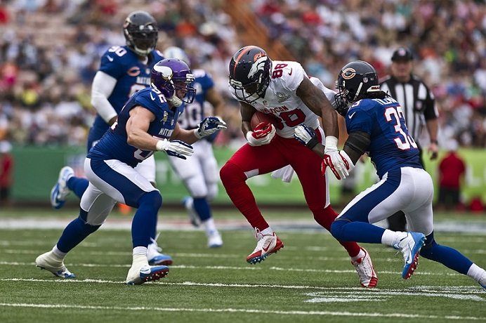 A football game in front of a packed crowd