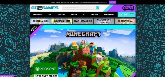 This screenshot of the home page for Go2Gameshas a large image of a screenshot from Minecraft, including characters like Alex, Steve, a pig, a sheep, a dog, a creeper, a zombie, and other characters on a high mountain, in front of an aqua and black background. 