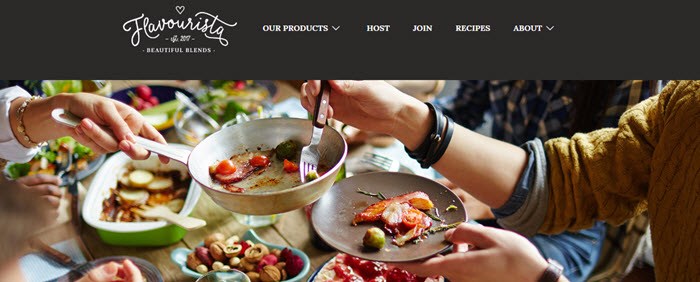 Flavourista Website Screenshot showing people and food around a table