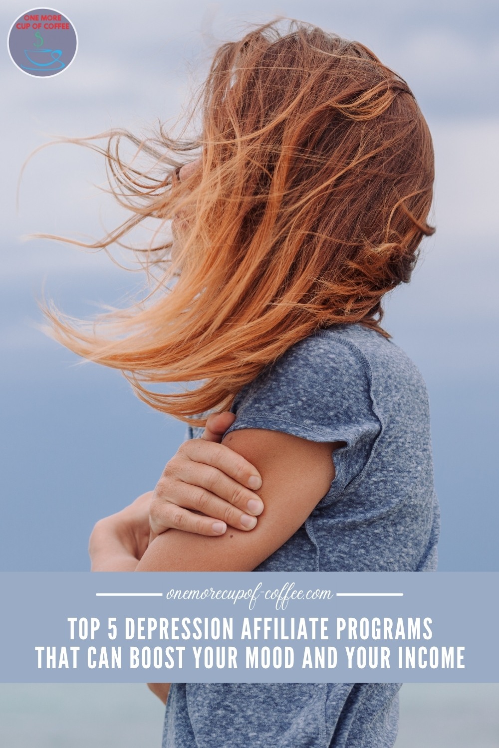 woman's side profile wearing a blue t-shirt, hugging herself, with her red hair covering her face because of the wind; with text overlay 