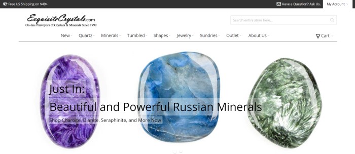 This screenshot of the home page for Exquisite Crystals has a dark header announcing free shipping, a white background, and three large photo of individual stones in purple, blue, and green, behind an announcement of new arrivals of Russian minerals. 