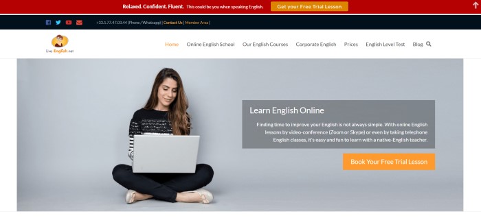 This screenshot of the home page for Live-English.net has a red header with an orange call-to-action button for a free trial lesson, a black contact section, a white navigation bar with black text, and a light gray section with a photo of a smiling dark haired woman in a black and white sweater and black pants, sitting cross-legged with an open laptop on her knees.