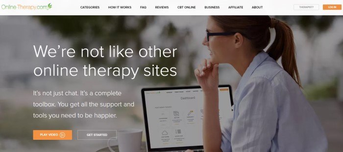 This screenshot of the home page for Online Therapy contains a filtered photo of a sideview of a smiling woman in glasses and a ponytail looking away from her open computer screen, along with white text that reads 