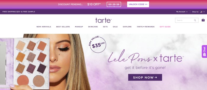 This screenshot of the home page for Tarte Cosmetics has a pink and purple discount header, a white navigation bar, and a photo of a blonde woman with brown and pink makeup on holding the makeup palette she used over half of her face, along with a sales announcement in purple lettering and a dark purple call-to-action button. 