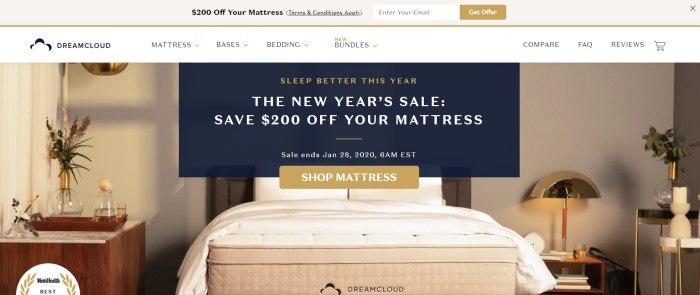 This screenshot of the home page for DreamCloud has a beige header, white navigation bar, and a photo of a white and beige bedroom with white curtains, flowers on the night stand, and white blankets and pillows on top of a DreamCloud mattress, along with a sales announcement in black, gold, and white. 