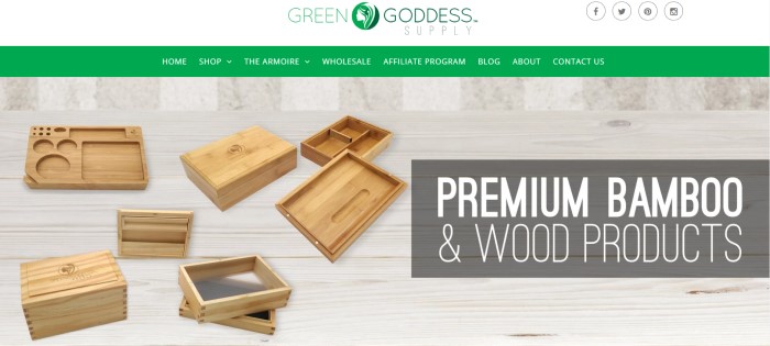 This screenshot of the home page for Green Goddess supply has a white header with a green logo, a green navigation bar, and a photo of several wooden boxes and trays, along with a darker filtered text area with white text announcing premium bamboo products.