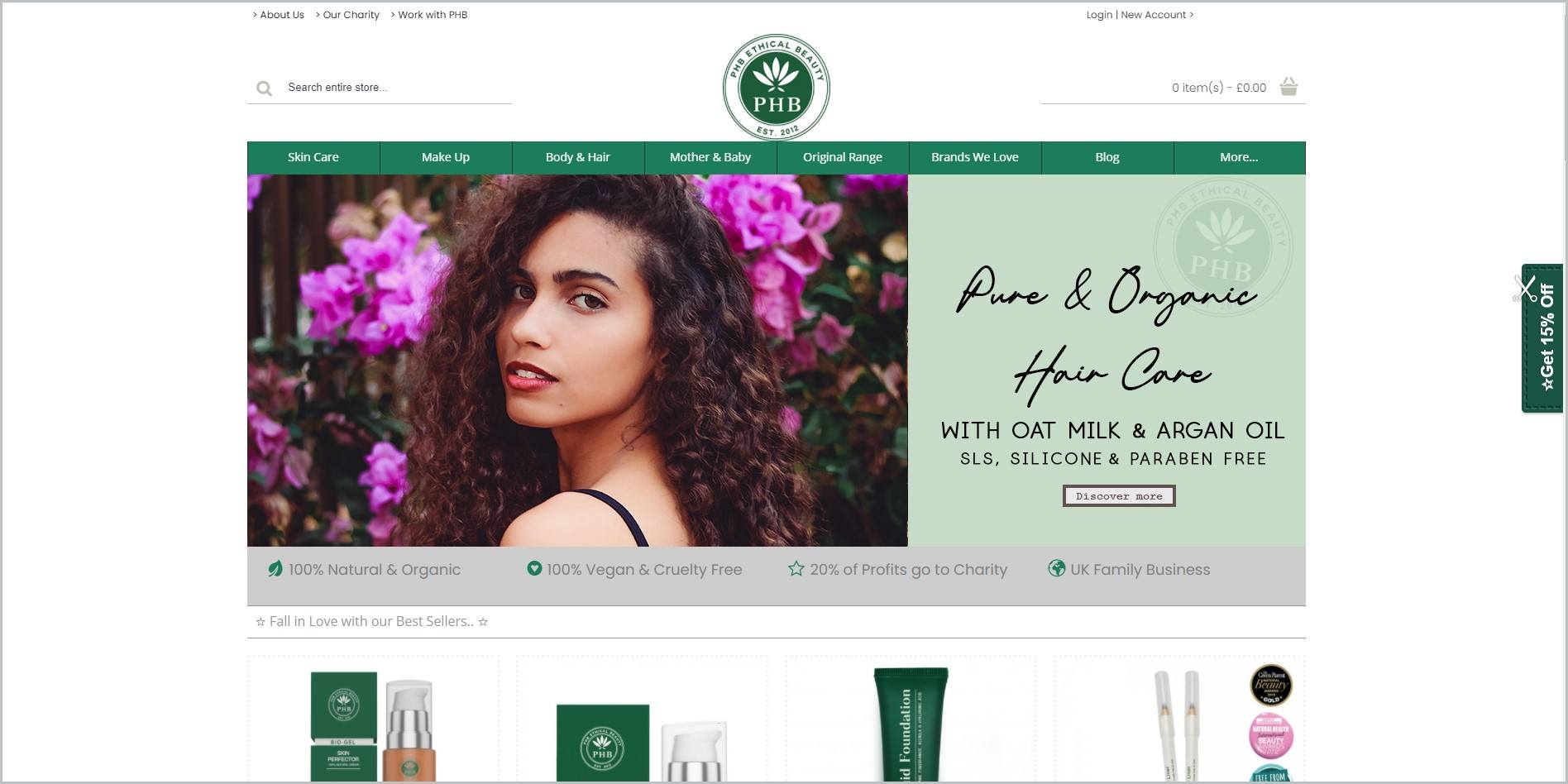 screenshot of PHB Ethical Beauty homepage, with white header with the website's name and logo, underneath it is the green main navigation bar, it also showcases an image of a woman as well as some of the website's products