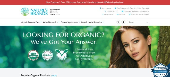 This screenshot of the home page for Nature's Brands has a red header, a white navigation bar, and a large photo showing a blurry green background with the face of a dark-haired woman peeking in from the right side of the page, along with text announcing popular organic products.