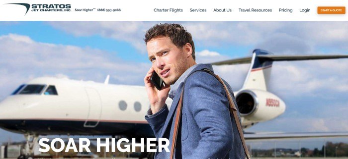 This screenshot of the home page for Stratos Jet Charters shows a young man with brown hair and a blue suit talking on a cell phone as he is about to get on a white jet, behind white text that reads "Soar higher."