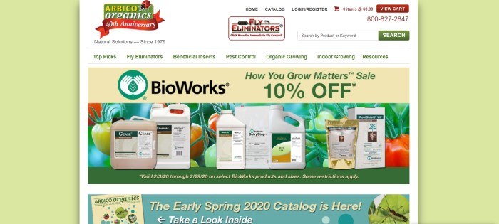 This screenshot of the home page for Arbico Organics has a pale green background on the left and right sides of the page, with a middle section that includes a white background, dark green text in a white navigation bar with red and green elements in a white header, above a tan 10% discount bar, a photo of several bottles of natural pesticides in front of a crop of ripening tomatoes, and an aqua sales bar announcing the new spring catalog.