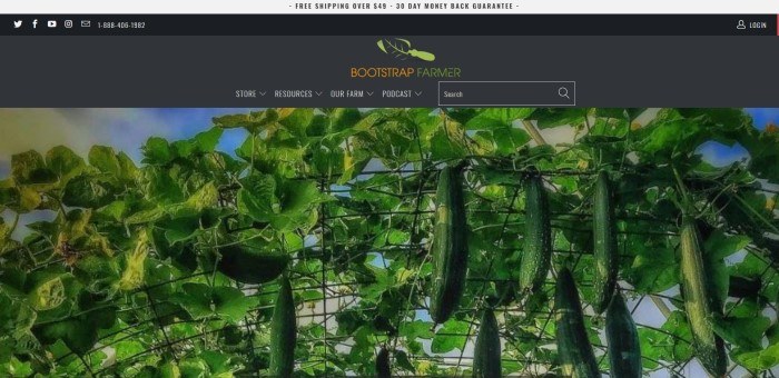 This screenshot of the home page for Bootstrap Farer has a black header and navigation bar, an orange and green logo, and a large photo of cucumber vines hanging from black wire fencing.