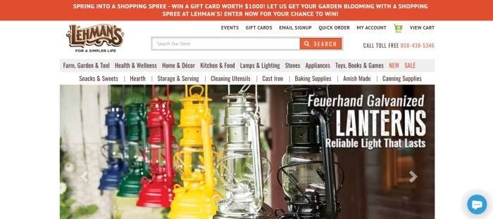 This screenshot of the home page for Lehman's has an orange header, a white and gray navigation bar, and a large photo showing a row of kerosene lanterns in green, blue, silver, yellow, red, and black, with white text announcing the lanterns.