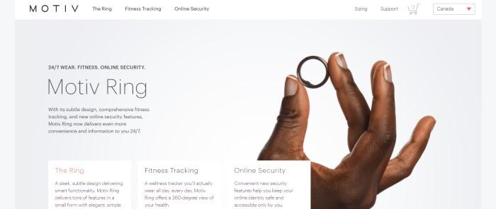 This screenshot of the home page for Motiv has a white navigation bar above a photo of a brown-skinned hand holding a dark metal ring in front of a light gray background, along with black text describing the Motiv Ring and three small text boxes at the bottom of the page telling more about the design, the fitness tracking, and the online security of this product.