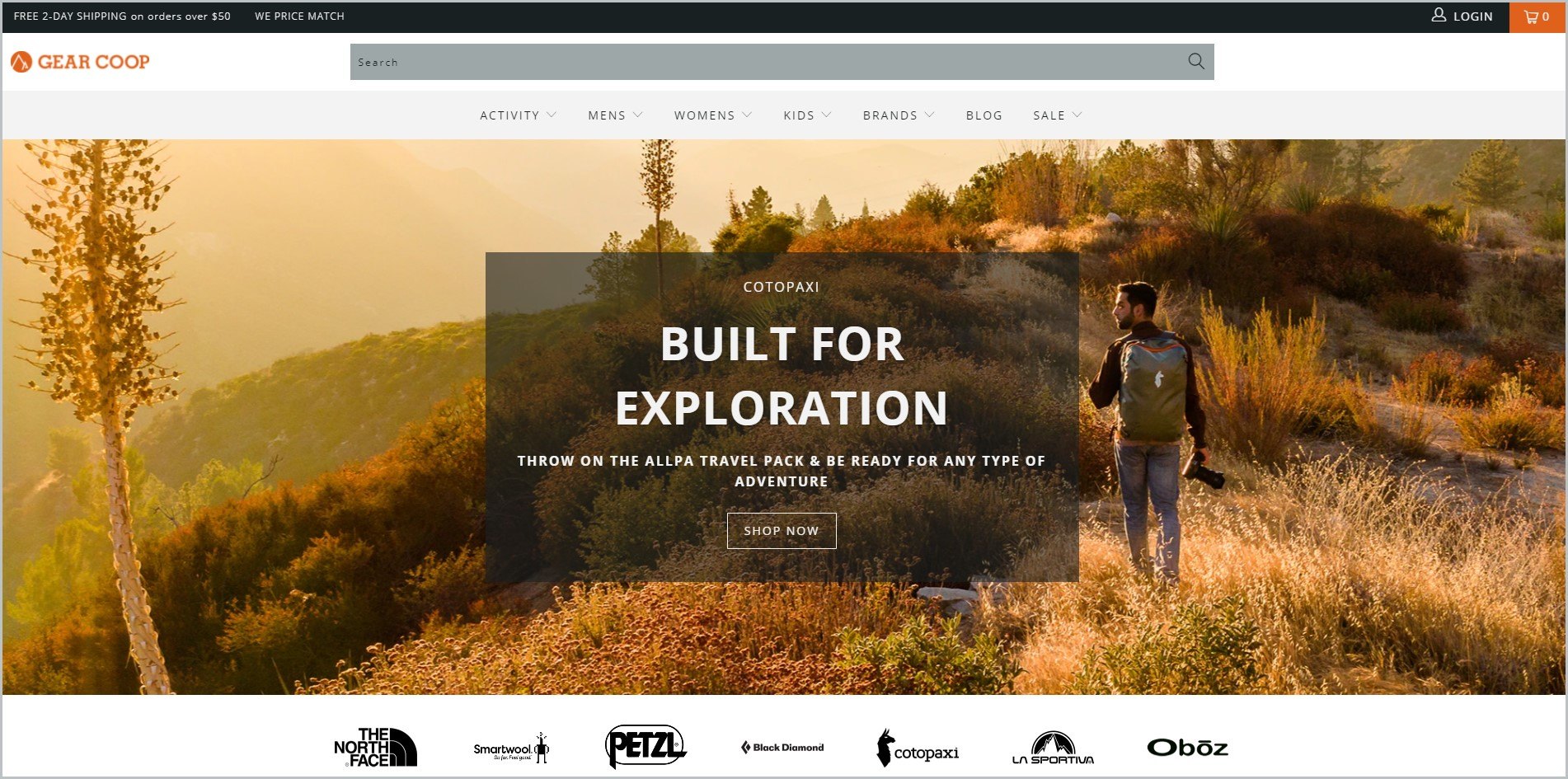 screenshot of Gear Coop homepage, with white header with the website's name and main navigation menu, it showcases an image of a man with a backpack and his camera hiking along the mountain