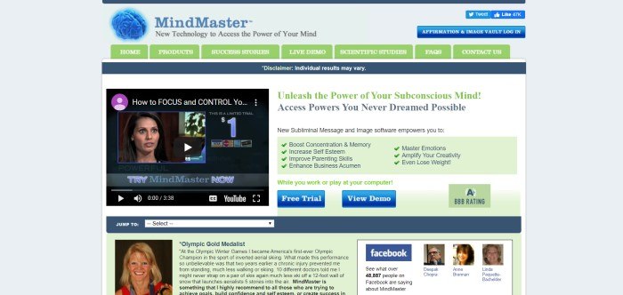 This screenshot of the home page for MindMaster has a gray background, a blue and green header, and text in black and green announcing the ability to unleash the power of the subconscious mind, along with a small black video box on the left side of the page showing a still shot of a woman talking, above a gray search bar and a green testimonial area with a photo of a blond smiling woman near it.