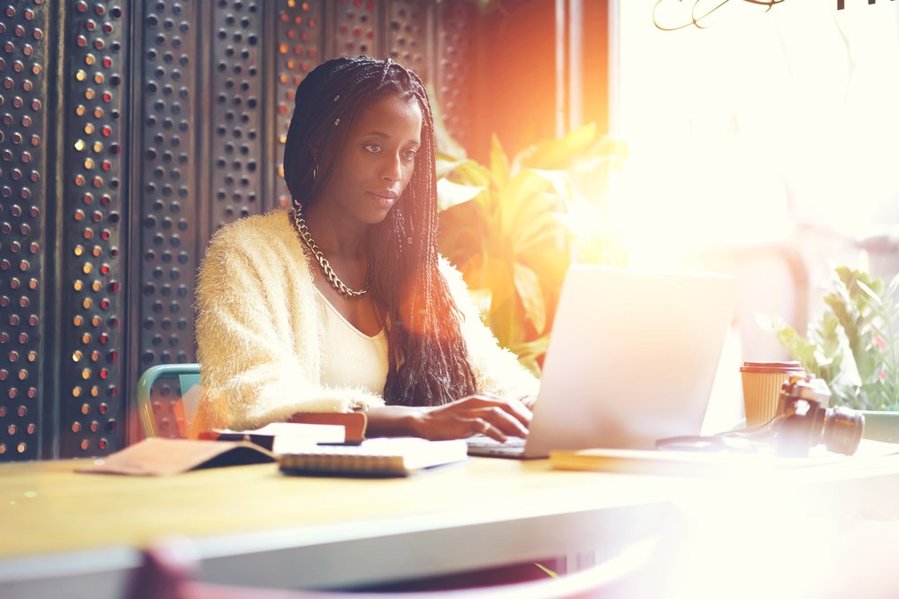 african american beauty blogger writing content for her website