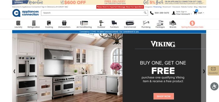 This screenshot of the home page for Appliances Connection has a pale yellow header with blue and pink lettering, a white search bar and navigation bar, and a main section with a large photo of a nice kitchen with white cupboards and several stainless steel appliances next to a black text announcement with white lettering describing a buy-one, get-one sale on Viking brand appliances, along with a pale red call to action button.