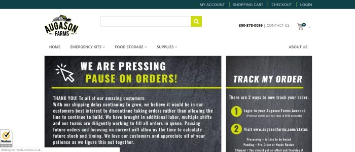 This screenshot of the home page for Augason Farms has a dark header above a white navigation bar, along with two large gray sections in the center of the page, both with white and light green text, announcing a pause on taking new orders and a section for tracking orders, as well as a thank you for allowing the company to focus on filling orders during the coronavirus crisis rather than taking new ones.