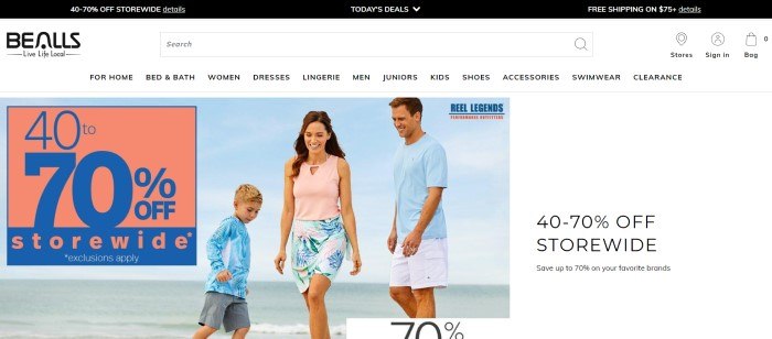 This screenshot of the home page for Bealls Florida has a black header, a white navigation bar, and a photo of a smiling man, woman, and boy in pink, blue, and white summer clothing playing on a beach, along with a sales announcement in pink and blue and another sales announcement with a white background. 