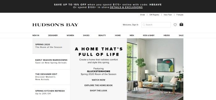 This screenshot of the home page for Hudson's Bay has a black header, a white navigation bar, and a white background with gray and white windows containing text describing Spring products, as well as a photo on the right side of the page showing a room decorated in light green, gray, gold, white, and red.