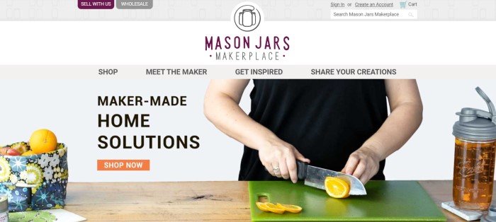 This screenshot of the home page for Mason Jars has a gray and white header, a gray navigation bar, and a photo of a woman in black cutting lemons on a green cutting board near a multicolored fabric basket holding fruit, along with black text announcing maker-made home solutions and an orange call-to-action button.