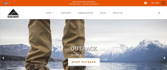 This screenshot of the home page for Ridgemont Outfitters has an orange header announcing free shipping, a white navigation bar, and a photo of a man's legs in hiking gear standing on the shore of a lake near some white-capped mountains, along with a white and orange call-to-action button.