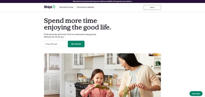 This screenshot of the home page for Shipt has a dark header, a white secondary header, and a white main section with dark words reading 'spend more time enjoying the good life' above a photo of a dark-haired woman smiling at a little girl who is playing with a vegetable leaf as they put away groceries.