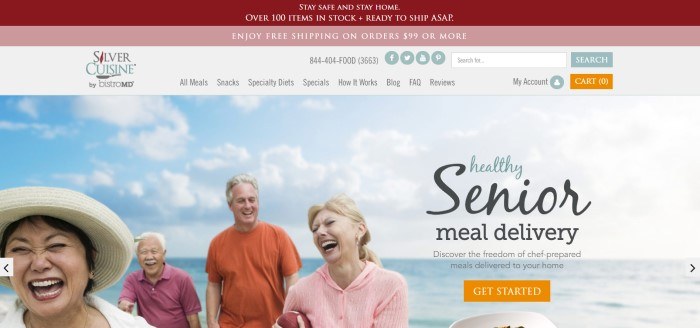 This screenshot of the home page for Silver Cuisine has a burgundy header, a pink secondary header announcing free shipping, a white navigation bar, and a photo of four aging men and women laughing as they play on a beach with blue skies, along with an invitation to order healthy meals for seniors and an orange call to action button.