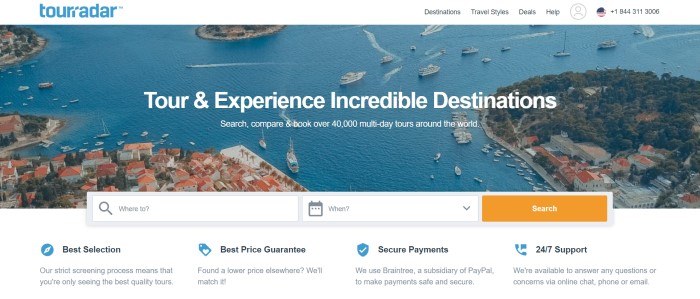 This screenshot of the home page for TourRadar has a large aerial photo of a bay with boats coming and going in the water, near shores with trees and orange-roofed white houses, above a search bar and a white section with blue icons and black text where customers can learn more about the tour selection, price guarantee, secure payments, and 24/7 support.
