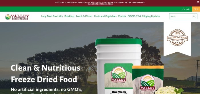 This screenshot of the home page for Valley Food Storage has a dark red header, an empty green bar, a white navigation bar with green text, and a photo of some food storage items in pouches and buckets overlaying a photo of a country road, along with white text announcing nutritious freeze-dried food.