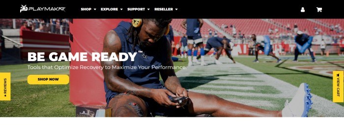 This screenshot of the home page for PlayMakar has a black navigation bar above a photo of a football player in a blue uniform sitting on a football field using PlayMakar devices while teammates practice in the background, along with white text inviting customers to be game-ready and a yellow call to action button.