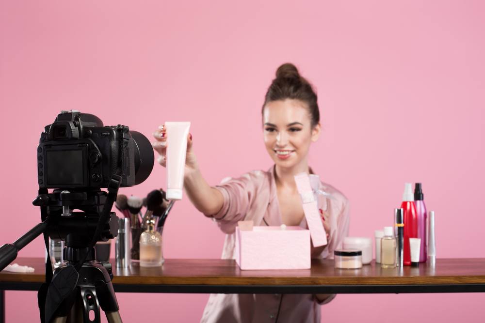 beauty blogger recording video advertising cosmetics products