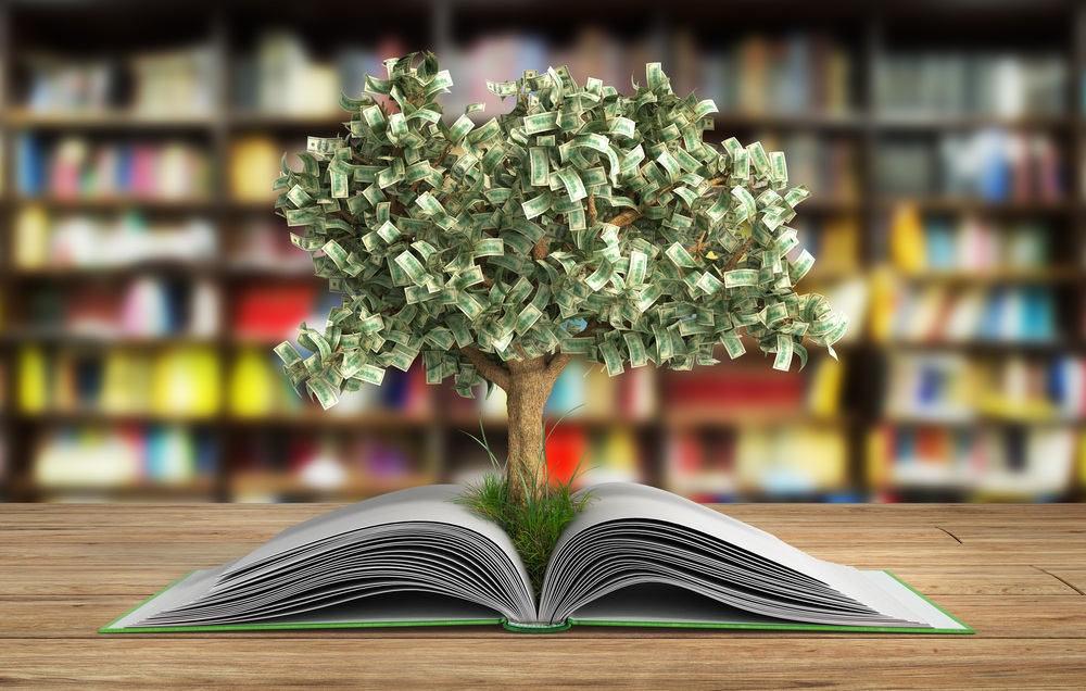 money tree growing from inside book