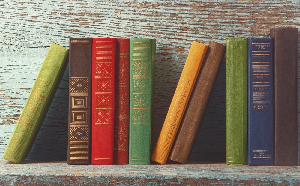 old books on wooden background