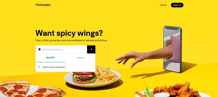 This screenshot of the home page for Postmates has a yellow background with photos of a plate of pizza, a plate of spicy wings, and a plate with a burger and fries, along with a hand reaching toward the food through a cell phone screen and a white search window to get customers started.