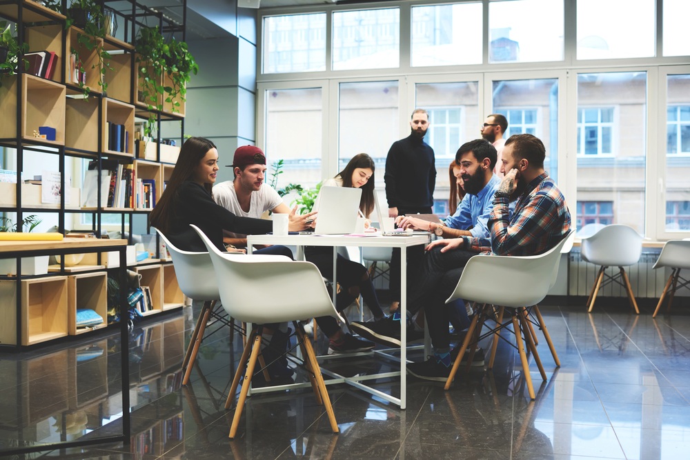 startup company in modern office with young people at table