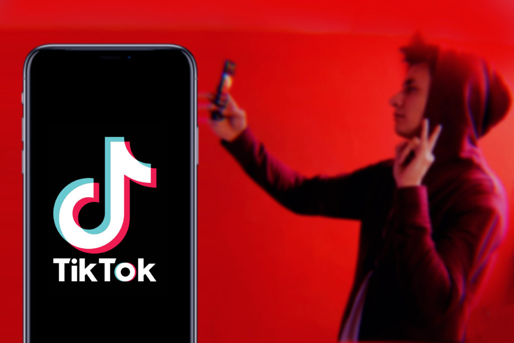 gen z taking selfie video on tiktop app