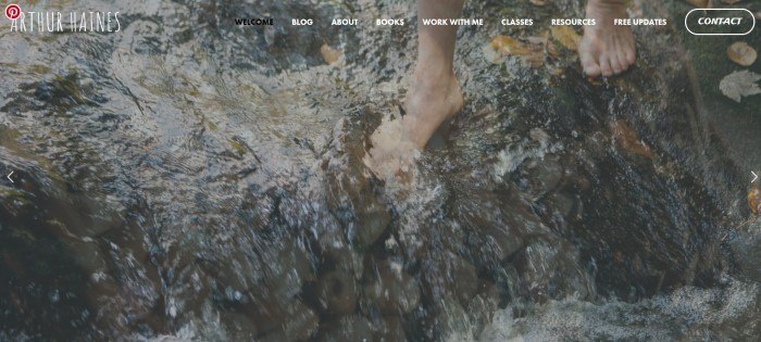 This screenshot of the home page for Ancestral Plants and Arthur Haines has a transparent navigation bar with white and black text over a photo of a man's feet wading barefoot in a stream.