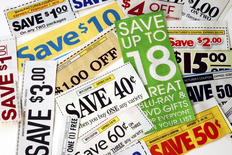 This photo shows a pile of printed paper ads and coupons in many colors, representing the best coupon affiliate programs